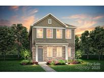 Charming two-story home with stone accents, manicured lawn, and beautifully landscaped garden beds at 15926 Parkside Crossing Dr # 322, Charlotte, NC 28273