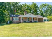 Charming brick home with a well-manicured lawn and inviting front porch at 28782 Canton Rd # A, Albemarle, NC 28001