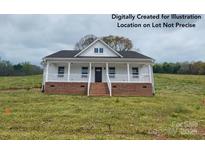 Charming single-story home featuring a covered front porch and a well-maintained yard at Tbd Alf Hoover Rd # 4, Lincolnton, NC 28092