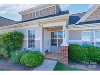 Inviting front entrance with well-maintained landscaping and classic architectural details including brick columns at 2153 Pavilion Ct, Rock Hill, SC 29732
