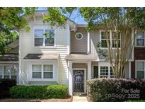 Charming two-story townhome with a well-manicured front yard and inviting entrance at 4938 Sunset Ridge Ct, Charlotte, NC 28269