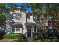 Charming home featuring a welcoming front porch, fresh landscaping, and neutral siding at 4938 Sunset Ridge Ct, Charlotte, NC 28269