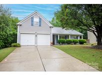 Charming home with a two-car garage and well-maintained front yard at 9359 Hillston Ridge Rd, Huntersville, NC 28078
