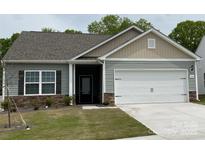 Charming one-story home featuring a two-car garage, stone accents, and well-maintained lawn at 1578 Doran Ter, Richburg, SC 29729