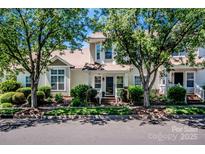 Charming two-story home with lush landscaping and mature trees in a desirable neighborhood at 17307 Villanova Rd, Huntersville, NC 28078
