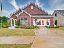 Charming single-story brick home featuring a welcoming entrance and manicured landscaping at 3089 Founding Fathers Dr, Gastonia, NC 28056