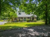 Charming one-story home with a well-manicured lawn, mature trees, and inviting curb appeal at 3387 Passmore Rd, Rock Hill, SC 29730