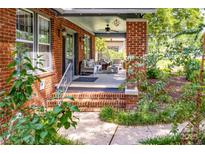 Charming front porch with brick columns and comfortable seating, perfect for relaxing outdoors at 510 Wiley Ave, Salisbury, NC 28144