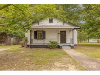 Charming home featuring a covered front porch, black trim, and landscaped yard at 10 Bolt Dr, Shelby, NC 28150