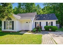 Charming one-story home with white siding, black shutters, and a well-manicured lawn and garden at 2432 Barkers Ridge Dr, Bessemer City, NC 28016