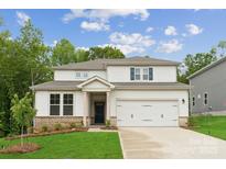Charming two-story home with a well-manicured lawn, inviting entrance, and a two-car garage at 9956 Manor Vista Trl, Kannapolis, NC 28027