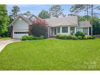 Charming single Gathering home with a well manicured front yard and mature trees at 104 Gallarie Pl, Salisbury, NC 28144