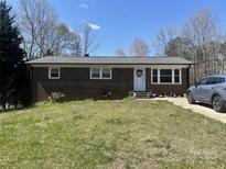 Charming brick home with a well-maintained lawn and a welcoming front entrance at 739 Owls Den Rd, Lincolnton, NC 28092