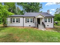 Charming one story home with brick exterior, black shutters and a well-manicured lawn at 2376 S Us 321 Hwy, Newton, NC 28658
