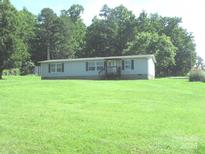 Well maintained single story home featuring a large lawn and traditional facade at 3942 Benny Shrum Ln, Maiden, NC 28650