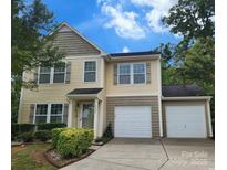 Charming two-story home featuring a two-car garage, well-maintained lawn, and inviting front entrance at 4009 Egrets Nest Ct, Mount Holly, NC 28120