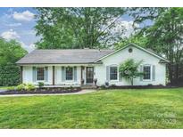 Charming single story home featuring a well maintained lawn, flower beds, and traditional design at 6624 Lancer Dr, Charlotte, NC 28226