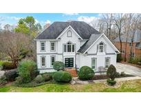 Charming two-story home with beautiful landscaped front yard at 520 Beacon Knoll Ln, Fort Mill, SC 29708