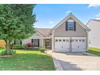 Charming home with a two-car garage, landscaped yard, and inviting front entrance at 8309 Shinkansen Dr, Charlotte, NC 28213