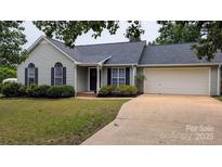 Charming single Gathering home with landscaped front yard and attached two car garage at 112 Brookshire Dr, Fort Mill, SC 29715