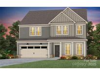 Charming two-story home with a craftsman-style exterior and an attached two-car garage at 15020 Meadows Hunt Ln # 159, Huntersville, NC 28078