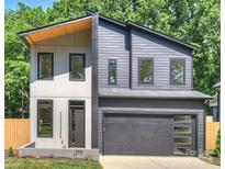 Modern two-story home featuring a two-car garage, contemporary design, and neutral color palette at 1711 Summey Ave, Charlotte, NC 28205