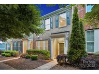 Charming brick townhome with well-maintained landscaping and inviting entrance at 17916 Ragtop Day Ln, Cornelius, NC 28031