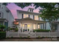 Charming two-story home with a welcoming front porch and classic white picket fence at 330 Horton Grove Rd, Fort Mill, SC 29715