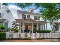 Charming white two-story home featuring a welcoming front porch and a picket fence at 330 Horton Grove Rd, Fort Mill, SC 29715