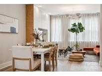 Bright dining area boasts a sleek white table with seating for six, open to the well-lit living space at 614 West End Dr, Charlotte, NC 28208