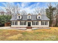 Charming Cape Cod style home featuring dormer windows, black shutters, and a well-maintained front yard at 642 Brynwood Dr, Rock Hill, SC 29732