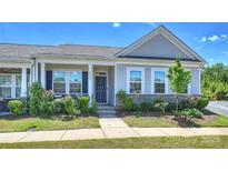 Charming single-story home with a well-manicured front yard and inviting entrance at 8853 Brakeman Dr, Waxhaw, NC 28173