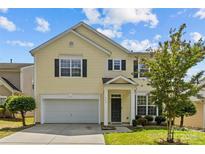 Charming two-story home with a manicured lawn and attached two-car garage at 4531 Dalbeth St, Charlotte, NC 28213