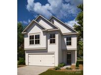 Charming two-story home featuring classic white siding and a welcoming two-car garage at 12744 Susanna Dr, Charlotte, NC 28214