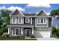 Charming two-story home showcasing stone accents, a covered entry, and a spacious two-car garage at 9930 Emerson Glen Dr, Kannapolis, NC 28027