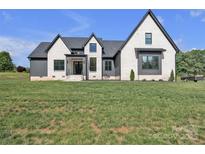 Beautiful exterior elevation showcasing modern design, neutral paint, black trim and windows at 1141 Harper Lee Dr, Newton, NC 28658