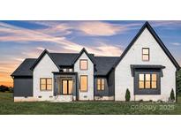 Beautiful two story home with modern black trim accents and professionally landscaped yard at 1141 Harper Lee Dr, Newton, NC 28658