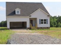 Charming single-Gathering home featuring gray siding, an attached garage, and classic architectural details at 145 Mason Tanner Ct, Rock Hill, SC 29730