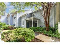 Charming townhome with covered front porch and lush landscaping at 6011 Treetop Ct, Charlotte, NC 28212
