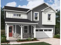Charming two-story home featuring gray siding, stone accents, a covered porch, and an attached two-car garage at 9858 Quercus Ln, Huntersville, NC 28078