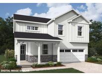 Charming two-story home with stone accents, covered entry, white siding, and attached garage at 9858 Quercus Ln, Huntersville, NC 28078