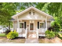 Charming home featuring a welcoming front porch with white columns and an inviting entrance at 204 S Elm St, Cherryville, NC 28021