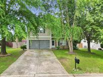 Charming two-story home featuring a two-car garage, landscaped front yard, and inviting curb appeal at 2117 Seabrook Ln, Fort Mill, SC 29715