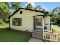 Charming home featuring siding and black trim, offering curb appeal with a touch of modern elegance at 443 Brandon St, Davidson, NC 28036