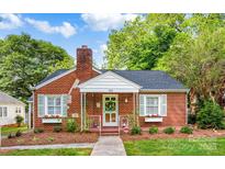 Charming brick home with a well-maintained yard, a classic chimney, and a quaint front porch entrance at 625 N Center St # 4, Statesville, NC 28677