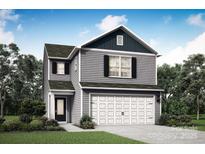 Two-story home featuring gray siding, a two-car garage, and well-maintained landscaping at 3342 Strong Box Ln, Gastonia, NC 28052