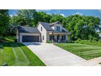 Charming traditional-style home with a spacious front yard, covered porch, and attached two-car garage at 4941 Southview Dr, Hickory, NC 28602