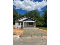 Charming single story home with a new driveway and lovely curb appeal at 1024 Short St, Salisbury, NC 28144