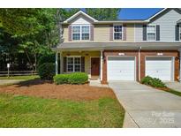 Charming townhome featuring a well-manicured front yard and attached single-car garage in a friendly community at 1113 Geyser Ct, Fort Mill, SC 29715