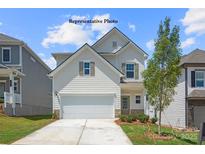 Charming two-story home featuring a two-car garage, tidy landscaping, and a welcoming front entrance at 1278 Langston Ln, Salisbury, NC 28144